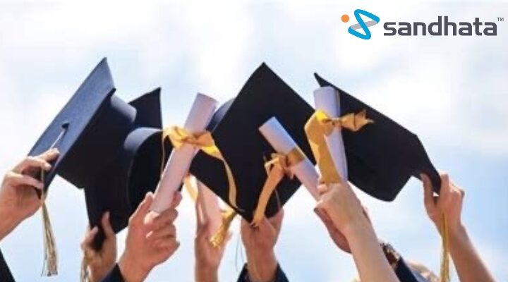 people waving their graduation caps in the air