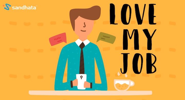 person sitting at a desk with a drink. Text: Love my job