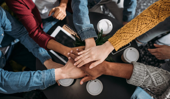 team holding hands