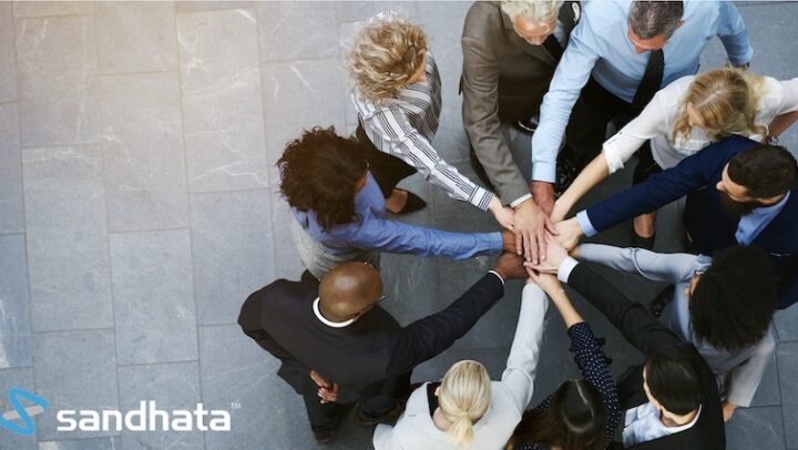 Picture team members with their hands together