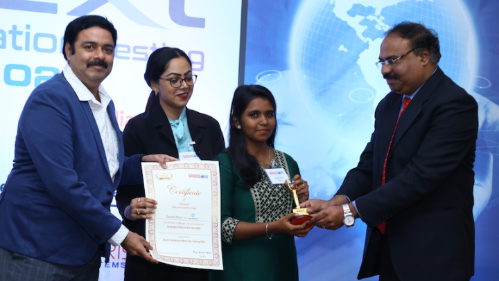 Janani Priya collecting her award for Graduate Tester of the Year 2022